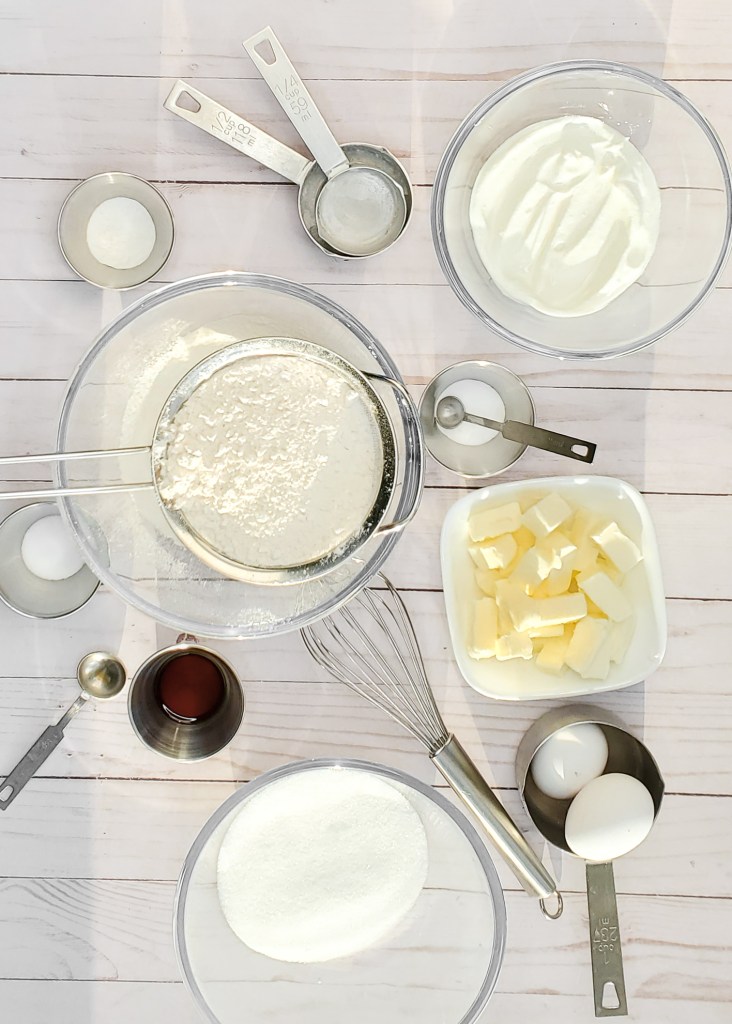 Birds eye view of cake ingredients on a wooden surface